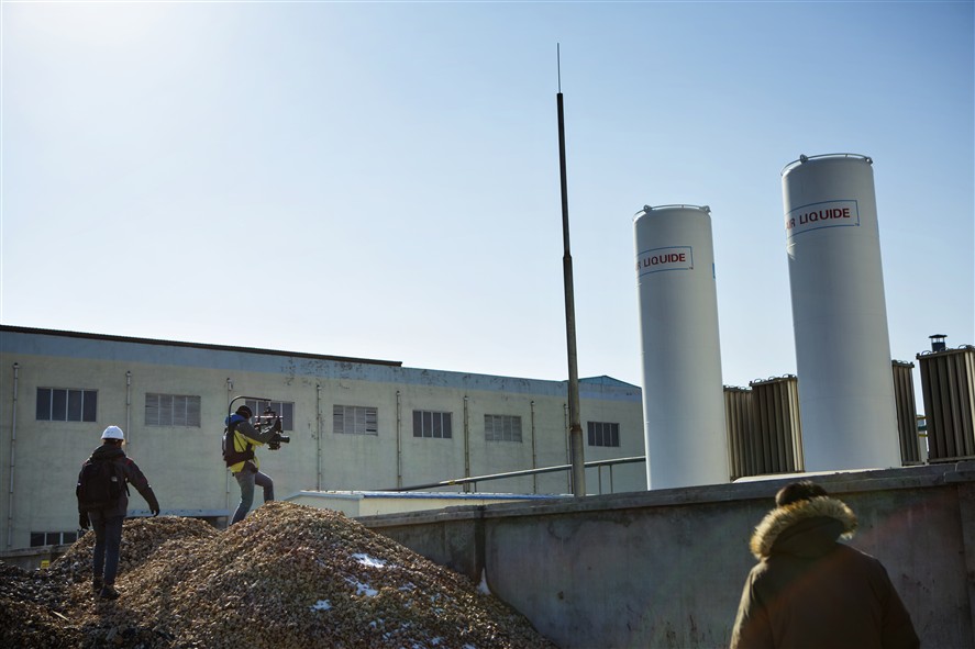 Shanghai production crew coordinating a shoot in an industrial location